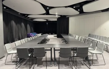 IQ Business Center in Kyiv- meeting room with U-shaped table setup and grey chairs