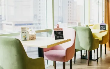 Pesto Cafe - sunlit dining area offering a wide panoramic view through large windows