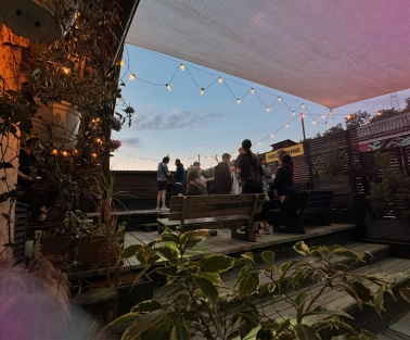 Vechirochka - outdoor terrace with string lights and guests