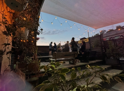 Vechirochka - outdoor terrace with string lights and guests