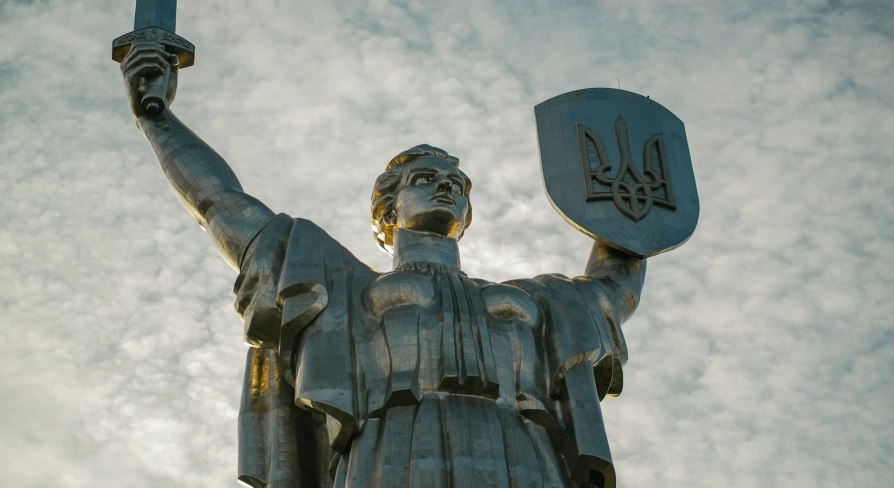 Motherland - majestic steel statue raising a sword and shield with a trident to the sky