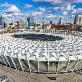 NSC Olimpiyskiy in Kyiv - impressive modern exterior architecture of the stadium showing the white membrane roof and glass facade