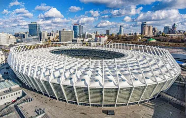 NSC Olimpiyskiy in Kyiv - impressive modern exterior architecture of the stadium showing the white membrane roof and glass facade