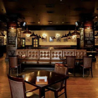 Goodman Steak House - classic steak house interior with dark wood paneling and booth seating