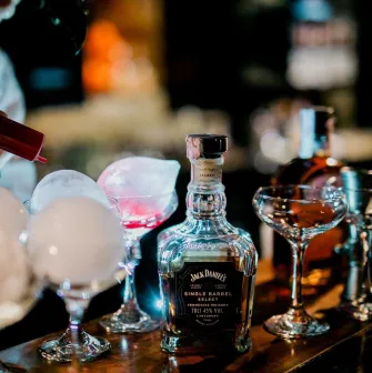 Alchemist Bar bartender crafting cocktails with smoke bubbles