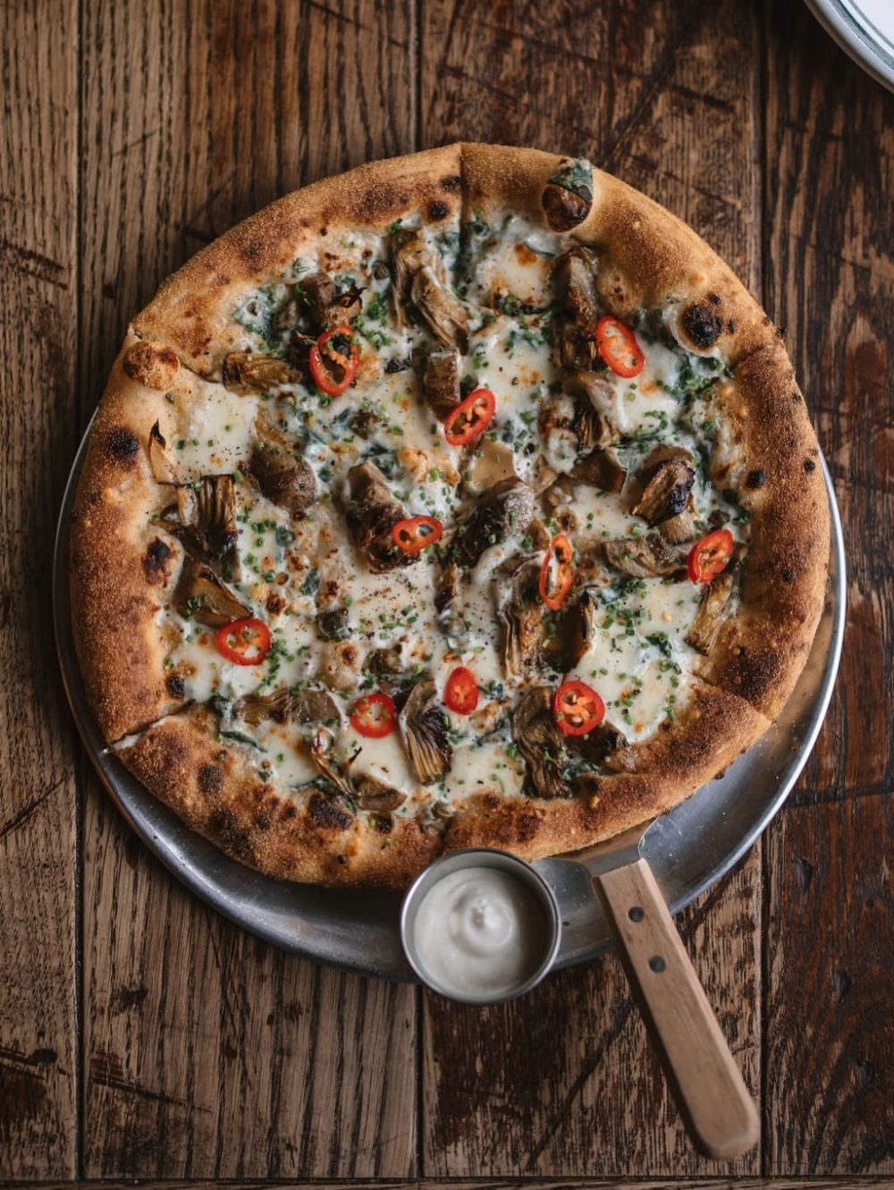 Pizza with mushrooms and hot peppers at Mimosa Brooklyn Pizza
