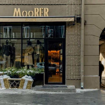 Moorer boutique entrance with festive decorations in Passage in Kyiv
