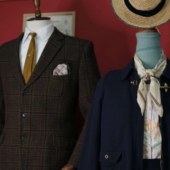 Mannequins in classic men's and women's clothing at the Levkovsky Vintage store in Kyiv