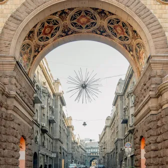 Grand entrance arch of Passage decorated with traditional mosaics in Kyiv