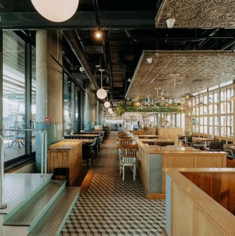 View of the Milk Bar terrace in TSUM through panoramic windows