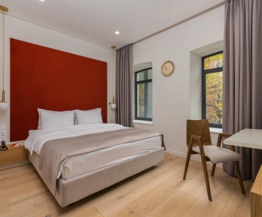 Sophia Hotel - close-up view of a large decorated bed with pillows
