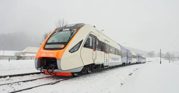 Ukrzaliznytsia passenger train operating during winter in Kyiv