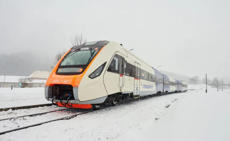 Ukrzaliznytsia passenger train operating during winter in Kyiv