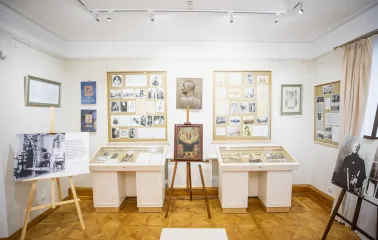 Muzei Hetmanstva in Kyiv - museum hall displaying a religious icon on a wooden easel surrounded by historical exhibits and portraits of Ukrainian leaders