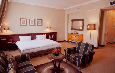 Opera Hotel - comfortable bed in a beautifully decorated room with dark wood