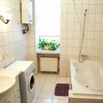 Kashtan Guest House - clean bathroom with shower and white tiles