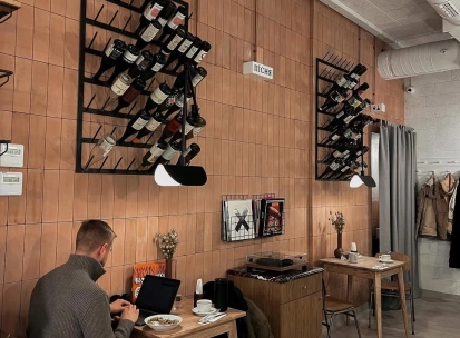 Spelta - rustic interior featuring wooden tables chairs and a decorative bread display