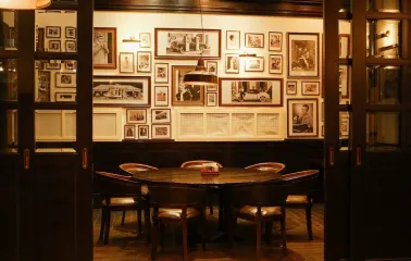 Goodman Steak House - spacious, elegant dining room with warm lighting and comfortable seating