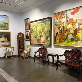 Soviet-era paintings and antique furniture at L'Art Gallery in Kyiv