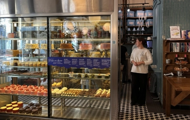 Milk Bar - dessert display with cakes and pastries in glass case