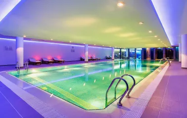 Hyatt Regency - indoor swimming pool with a bright, minimalist design