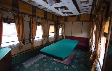 Railway Museum in Kyiv - interior of a vintage luxury train carriage featuring a large green billiard table