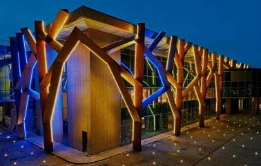 The building of the CEC “Parkovy” in Kyiv with night illumination on the facade