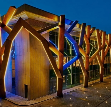 The building of the CEC “Parkovy” in Kyiv with night illumination on the facade