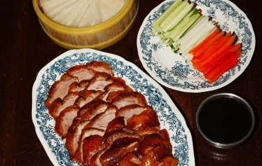 Restaurant Kytaiskyi Pryvit - close-up of sliced duck meat fresh vegetables and sauce