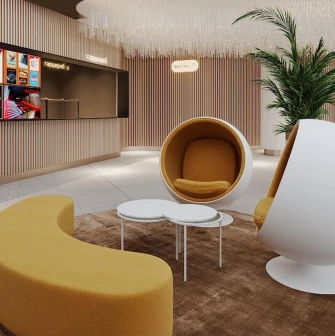 Modern bright lobby of the Multiplex cinema with designer armchairs and a ticket office