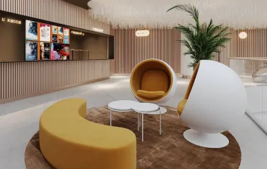 Modern bright lobby of the Multiplex cinema with designer armchairs and a ticket office