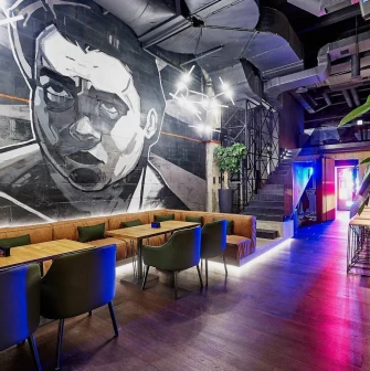 Par Bar - dining area with mural on wall and modern lighting