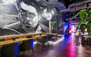 Par Bar - dining area with mural on wall and modern lighting