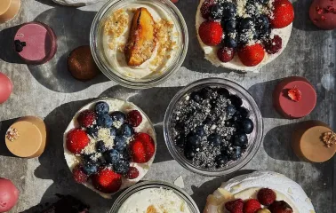 Milk Bar Tsum - close-up of a plated, stylish dessert with meringue and berries