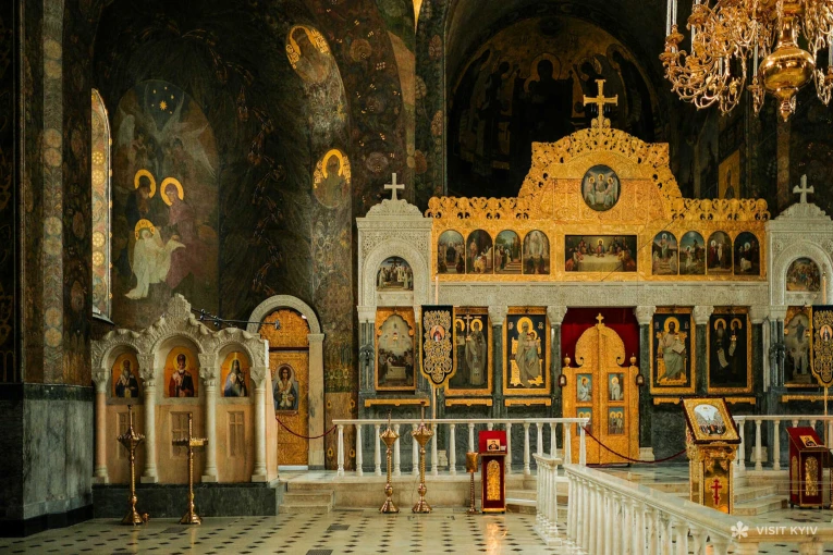 Gilded iconostasis and wall paintings inside the Refectory Church of Kyiv Pechersk Lavra in Kyiv