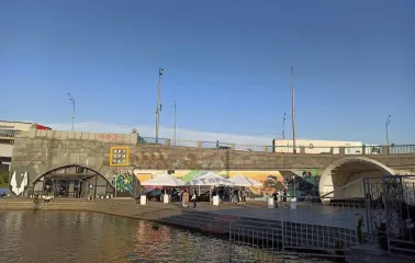 Art-Prychal - building facade viewed from the concrete river embankment