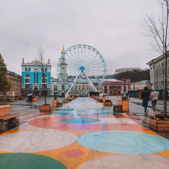 Kontraktova Square in Kyiv - ferris wheel and colorful painted pavement
