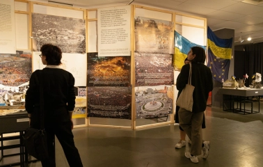Muzei Istorii Mista Kyieva in Kyiv - visitors viewing a historical exhibition with large photos of the Maidan revolution
