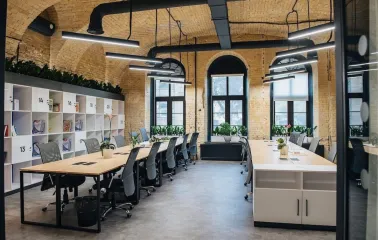 Coworking space with wooden tables and office chairs at Generator in Kyiv