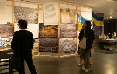Muzei Istorii Mista Kyieva in Kyiv - visitors viewing a historical exhibition with large photos of the Maidan revolution