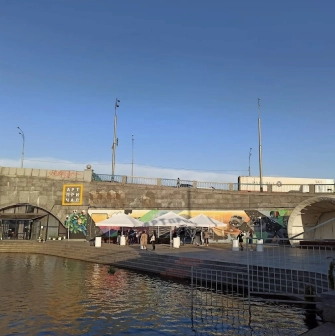 Art-Prychal - building facade viewed from the concrete river embankment