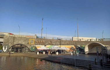 Art-Prychal - building facade viewed from the concrete river embankment