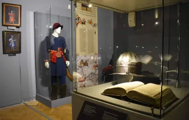 Cossack costume, helmet and ancient book at the National Museum of History of Ukraine in Kyiv