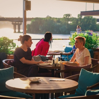 Mayak - spacious dining area offering a picturesque river view through windows