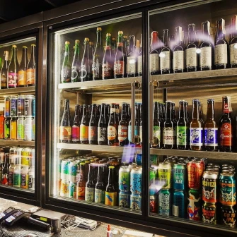 Punkraft - close-up of a wide selection of bottled craft beers on display shelves