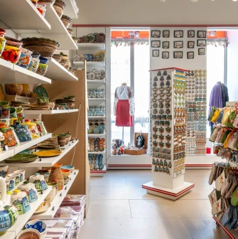 Shelves with ceramic pottery and souvenir magnets of the Folkmart store in Kyiv