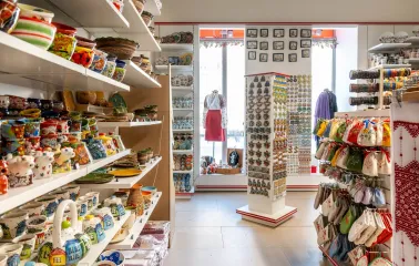 Shelves with ceramic pottery and souvenir magnets of the Folkmart store in Kyiv