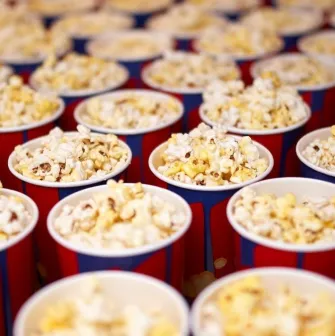 Portions of popcorn in branded cups at the Cinema Citi movie theater