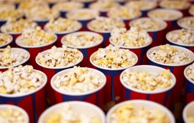 Portions of popcorn in branded cups at the Cinema Citi movie theater