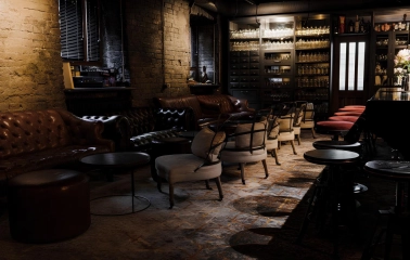 Beatnik Bar - intimate dining tables set with drinks in a cozy corner